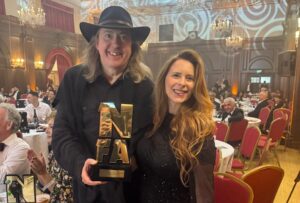 ‘Becoming Led Zeppelin’ director Bernard MacMahon (left) and producer Allison McGourty (right) at the UK’s National Film Awards in London on July 1, 2026. ‘Becoming Led Zeppelin’ won an award for best documentary / docu-series (Courtesy of Bernard MacMahon)